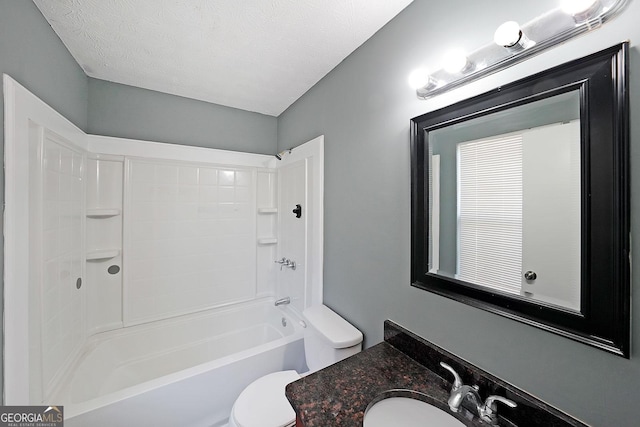 full bathroom featuring toilet, vanity, shower / tub combination, and a textured ceiling