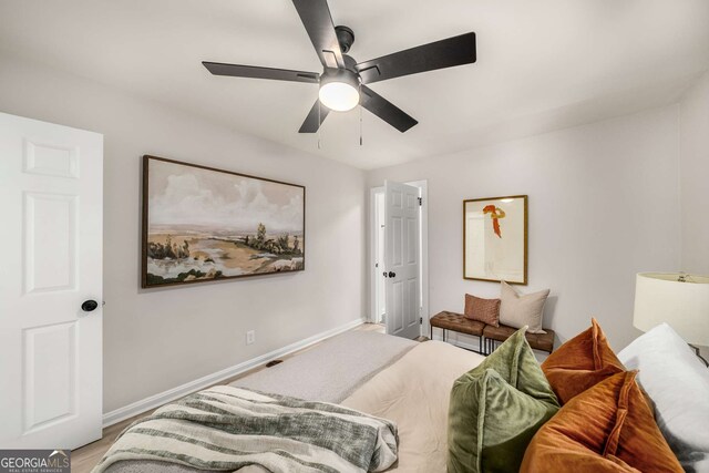 bedroom with baseboards and ceiling fan
