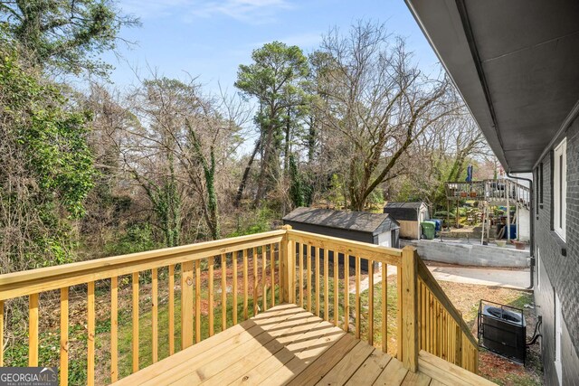 deck featuring an outbuilding and a storage shed