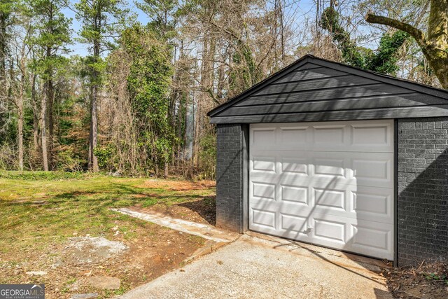 garage featuring driveway