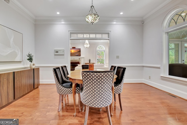 1575 Oak Mountain Rd, Shiloh, GA 31826 - dining space with light wood-style floors, crown molding, recessed lighting, and baseboards
