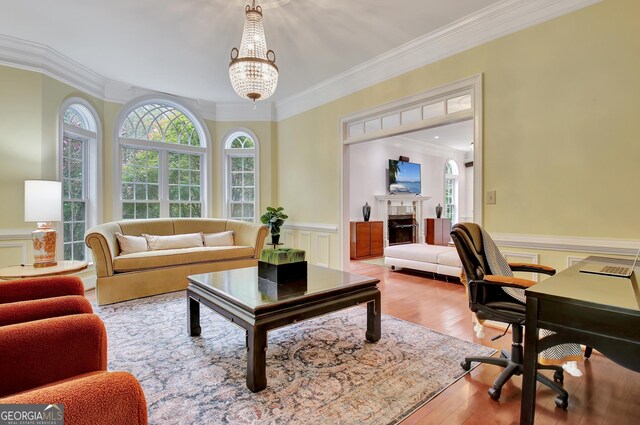 1575 Oak Mountain Rd, Shiloh, GA 31826 - office featuring ornamental molding, a fireplace, wainscoting, wood finished floors, and a chandelier