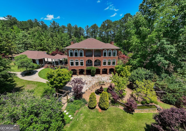 1575 Oak Mountain Rd, Shiloh, GA 31826 - view of front of house featuring a chimney, a front yard, and brick siding