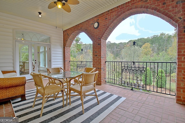 1575 Oak Mountain Rd, Shiloh, GA 31826 - view of patio with a ceiling fan, french doors, outdoor dining area, a wooded view, and a balcony