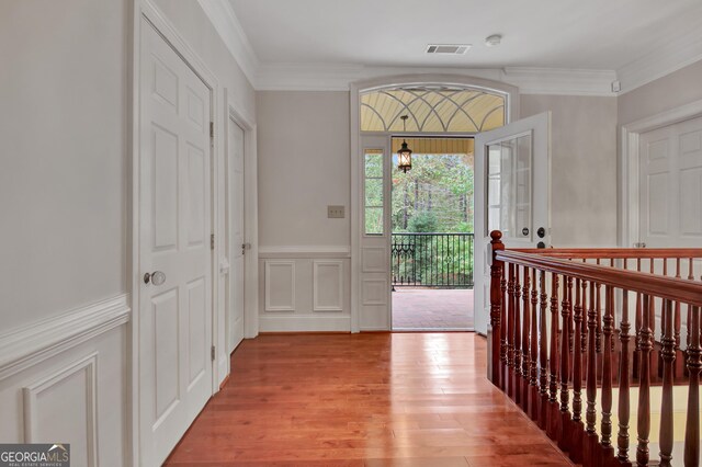 1575 Oak Mountain Rd, Shiloh, GA 31826 - foyer with a decorative wall, light wood finished floors, crown molding, and a wainscoted wall