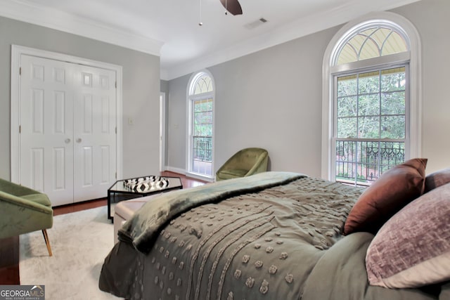 1575 Oak Mountain Rd, Shiloh, GA 31826 - bedroom with crown molding, wood finished floors, a closet, and a ceiling fan
