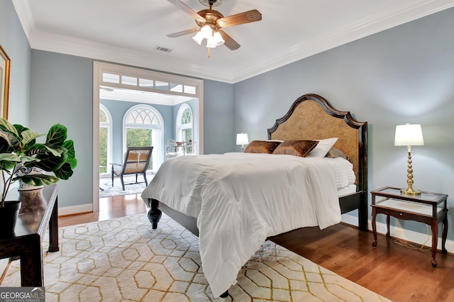 1575 Oak Mountain Rd, Shiloh, GA 31826 - bedroom featuring wood finished floors, crown molding, baseboards, and a ceiling fan