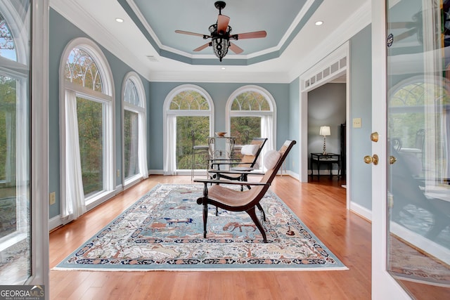 1575 Oak Mountain Rd, Shiloh, GA 31826 - living area featuring crown molding, visible vents, wood finished floors, ceiling fan, and a raised ceiling