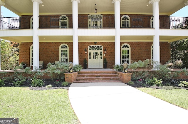 1575 Oak Mountain Rd, Shiloh, GA 31826 - view of front of home featuring a balcony, brick siding, and covered porch