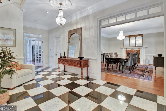 1575 Oak Mountain Rd, Shiloh, GA 31826 - entrance foyer with crown molding, wood finished floors, a decorative wall, and a wainscoted wall