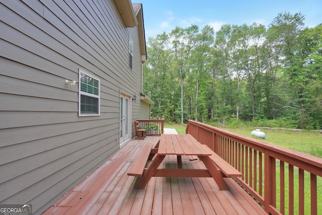 wooden deck featuring outdoor dining space