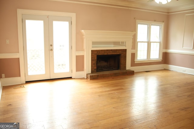 3348 Summit Turf Ln, Snellville, GA 30078 - unfurnished living room featuring hardwood / wood-style floors, ornamental molding, and french doors