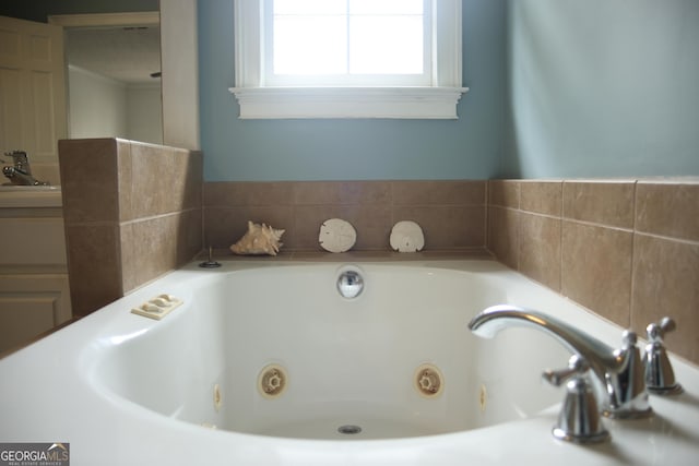 3348 Summit Turf Ln, Snellville, GA 30078 - bathroom featuring a jetted tub and vanity