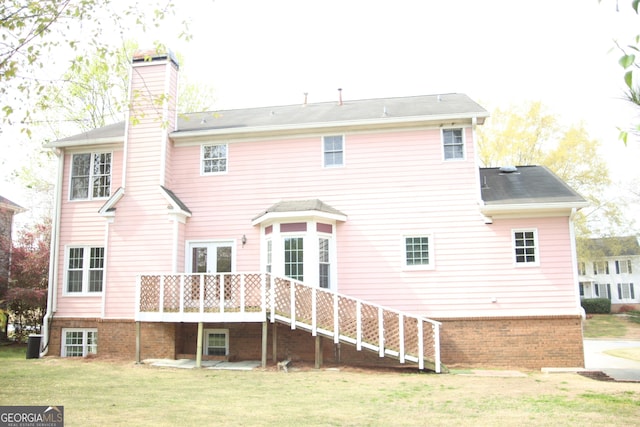 3348 Summit Turf Ln, Snellville, GA 30078 - back of property with a wooden deck, a yard, brick siding, and a chimney