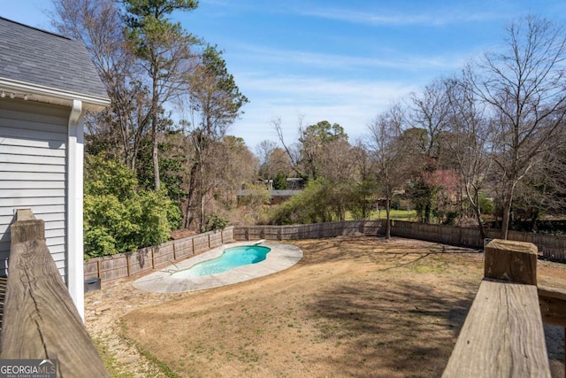 view of pool featuring a yard, a fenced in pool, and a fenced backyard