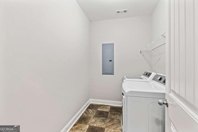 laundry area with visible vents, baseboards, electric panel, laundry area, and separate washer and dryer