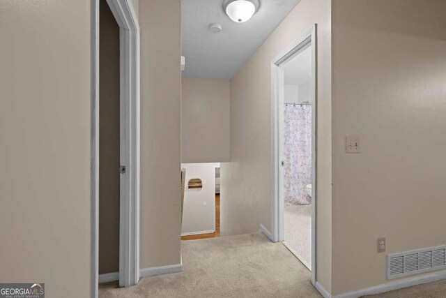 1417 Hickory Dr SW, Lilburn, GA 30047 - hall with carpet floors and baseboards