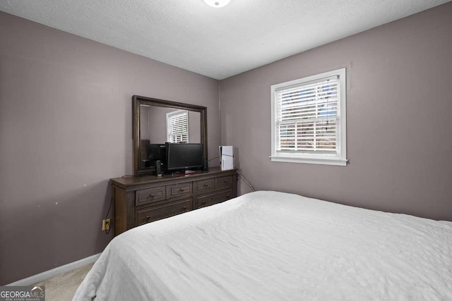 1417 Hickory Dr SW, Lilburn, GA 30047 - bedroom featuring multiple windows and carpet