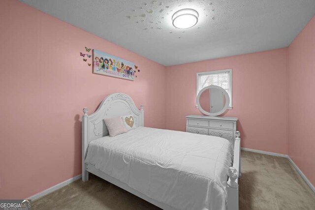 1417 Hickory Dr SW, Lilburn, GA 30047 - bedroom with carpet and a textured ceiling