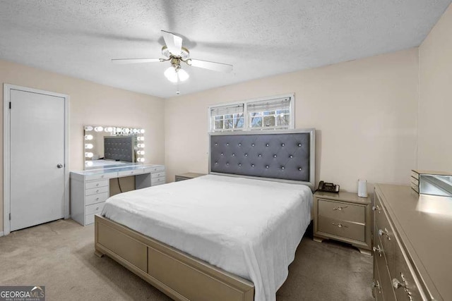 1417 Hickory Dr SW, Lilburn, GA 30047 - bedroom featuring light colored carpet, a ceiling fan, and a textured ceiling