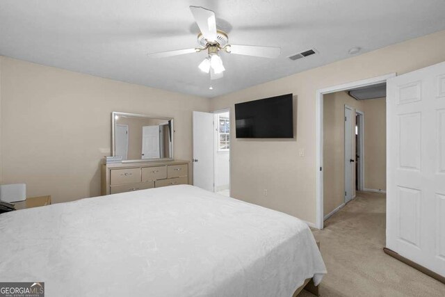 1417 Hickory Dr SW, Lilburn, GA 30047 - bedroom featuring light colored carpet and a ceiling fan