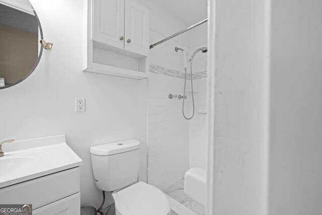 1417 Hickory Dr SW, Lilburn, GA 30047 - full bathroom featuring vanity and a tile shower