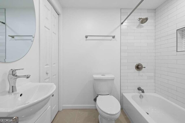 1417 Hickory Dr SW, Lilburn, GA 30047 - bathroom featuring shower / washtub combination, a closet, and tile patterned flooring