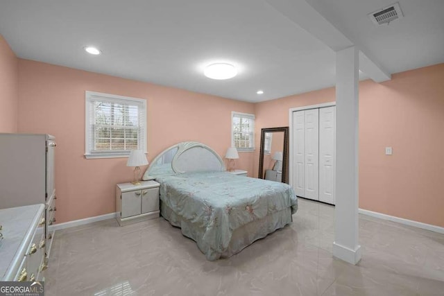 1417 Hickory Dr SW, Lilburn, GA 30047 - bedroom with multiple windows, recessed lighting, and a closet