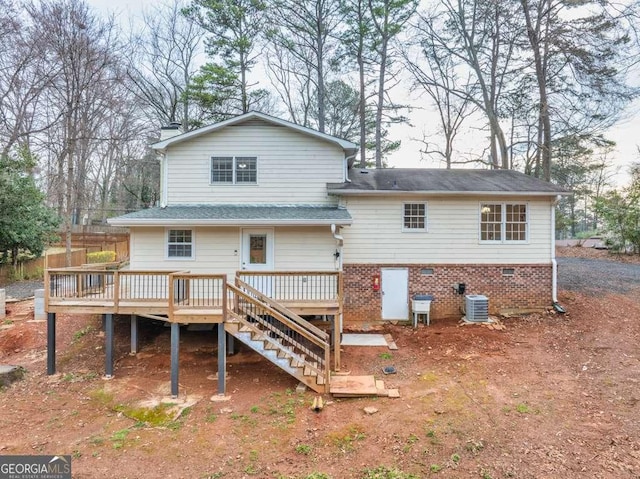 1417 Hickory Dr SW, Lilburn, GA 30047 - rear view of house featuring a wooden deck, stairway, and a chimney