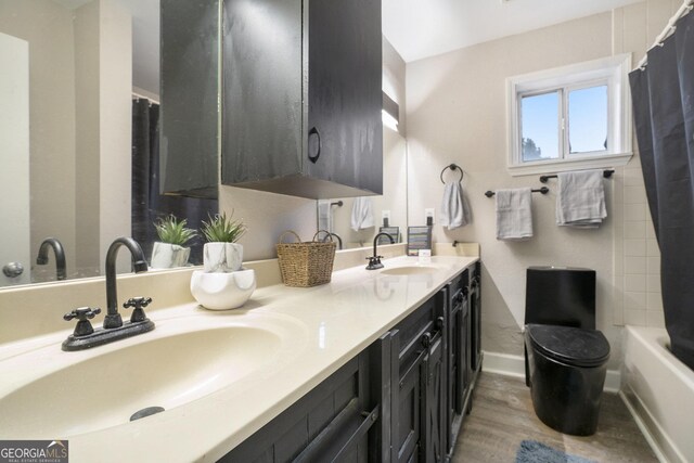 385 Ralph Mcgill Blvd NE Unit D, Atlanta, GA 30312 - full bath with double vanity, wood finished floors, and baseboards