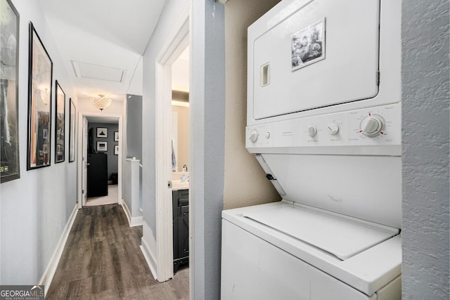 385 Ralph Mcgill Blvd NE Unit D, Atlanta, GA 30312 - clothes washing area with stacked washing machine and dryer, wood finished floors, baseboards, and attic access