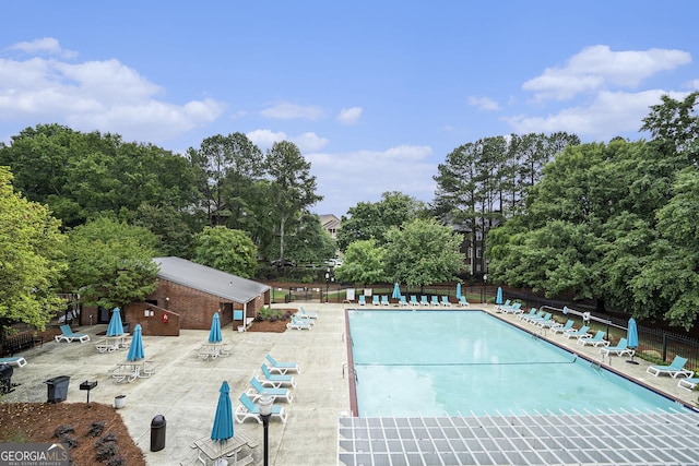 385 Ralph Mcgill Blvd NE Unit D, Atlanta, GA 30312 - community pool with fence, a patio, and view of wooded area