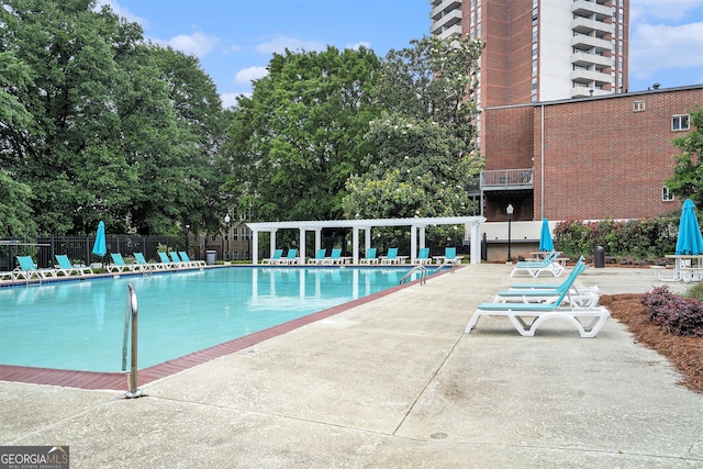 385 Ralph Mcgill Blvd NE Unit D, Atlanta, GA 30312 - community pool with a pergola, fence, and a patio area