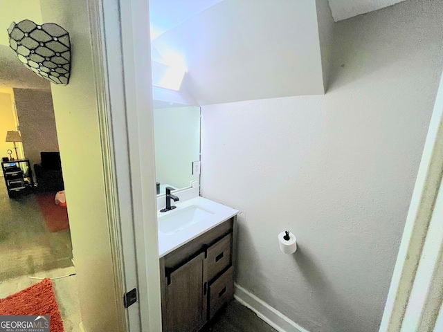 385 Ralph Mcgill Blvd NE Unit D, Atlanta, GA 30312 - bathroom featuring vanity and lofted ceiling