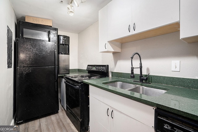 385 Ralph Mcgill Blvd NE Unit D, Atlanta, GA 30312 - kitchen featuring black appliances, a sink, light wood-type flooring, white cabinetry, and dark stone countertops