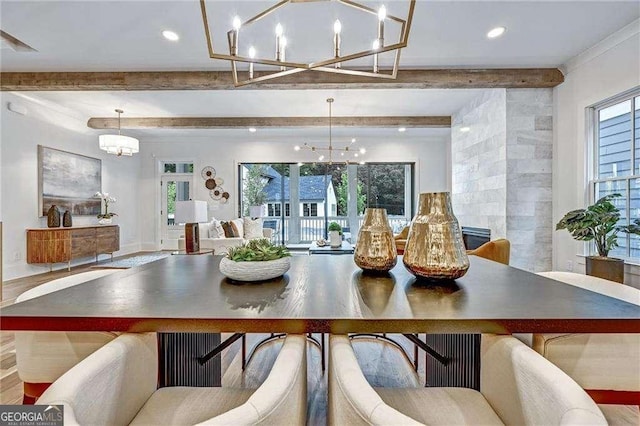 dining area with a notable chandelier, wood finished floors, beam ceiling, and recessed lighting