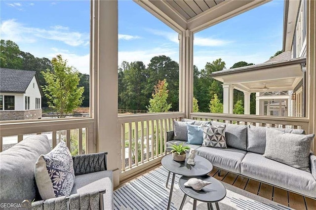 sunroom / solarium featuring an outdoor living space