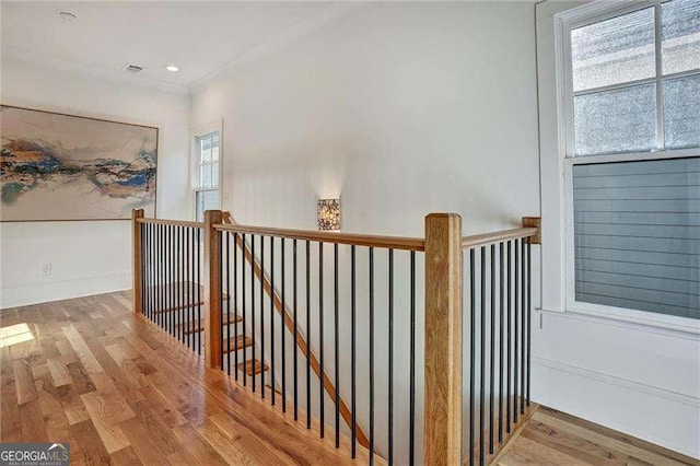 interior space featuring visible vents, an upstairs landing, recessed lighting, and wood finished floors