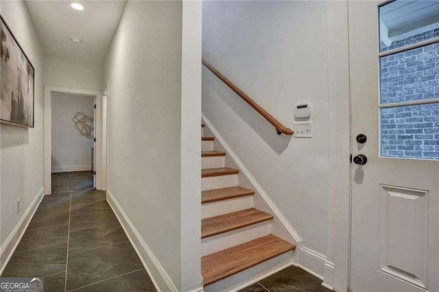 stairway with baseboards and recessed lighting