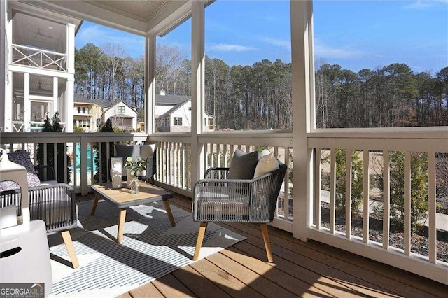 unfurnished sunroom with an outdoor living space