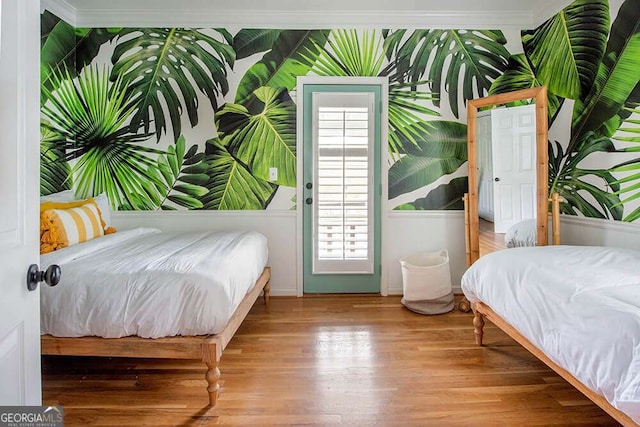bedroom with wood finished floors
