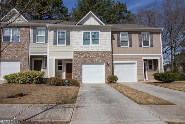 6342 Kinsland Ct, Lithonia, GA 30058 - multi unit property with a garage, board and batten siding, driveway, and brick siding