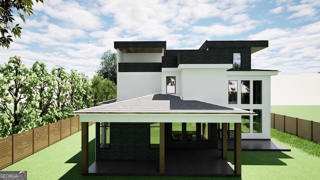 3534 Rockhaven, Atlanta, GA 30324 - back of house featuring a fenced backyard and stucco siding