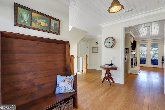 1108 E Mission Ln SE, Darien, GA 31305 - corridor with wooden ceiling, light wood-style floors, ornamental molding, an upstairs landing, and french doors