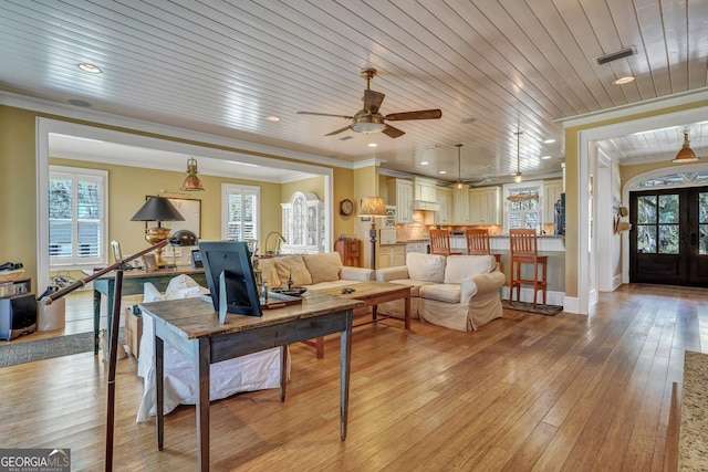 1108 E Mission Ln SE, Darien, GA 31305 - living room with crown molding, light wood finished floors, wooden ceiling, a ceiling fan, and baseboards