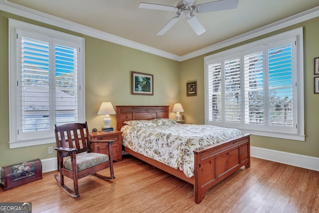 1108 E Mission Ln SE, Darien, GA 31305 - bedroom with light wood-style flooring, crown molding, baseboards, and ceiling fan