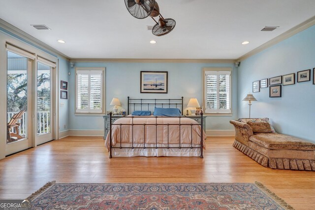 1108 E Mission Ln SE, Darien, GA 31305 - bedroom with access to outside, multiple windows, light wood-style floors, baseboards, and recessed lighting