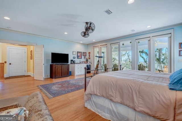 1108 E Mission Ln SE, Darien, GA 31305 - bedroom featuring wood finished floors, access to outside, and recessed lighting
