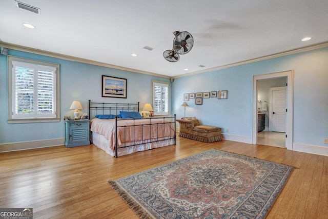 1108 E Mission Ln SE, Darien, GA 31305 - bedroom featuring ornamental molding, baseboards, wood finished floors, and recessed lighting