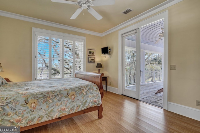 1108 E Mission Ln SE, Darien, GA 31305 - bedroom featuring access to outside, wood finished floors, crown molding, ceiling fan, and baseboards